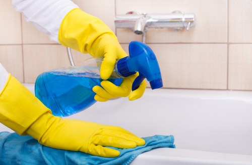 Cleaner reviewing safety steps before starting work